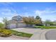 Beautiful exterior featuring a spacious driveway and manicured front yard at 7226 Dove Ct, Parker, CO 80134
