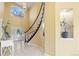 Inviting foyer with staircase, decorative niche, and neutral color palette at 7226 Dove Ct, Parker, CO 80134