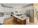 Spacious kitchen with a large island, stainless steel appliances, granite countertops and ample cabinet space at 7226 Dove Ct, Parker, CO 80134