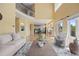 Open-concept living room leading to kitchen and dining area with a cozy fireplace and comfortable seating at 7226 Dove Ct, Parker, CO 80134