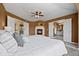 The main bedroom has a ceiling fan, a fireplace, and ensuite bathrooms on either side of the room at 7226 Dove Ct, Parker, CO 80134
