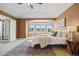 The main bedroom has a bay window, a ceiling fan, and an ensuite bathroom with a glass shower at 7226 Dove Ct, Parker, CO 80134