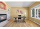 Cozy office with fireplace, built-in shelves, and natural light at 7226 Dove Ct, Parker, CO 80134