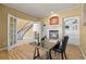 Bright office featuring fireplace, built-in shelving, and a large window at 7226 Dove Ct, Parker, CO 80134
