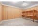 Utility room in the basement has wood-paneled walls and shelving at 7226 Dove Ct, Parker, CO 80134