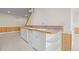 Basement wet bar area features wooden countertop, white cabinets, and convenient sink at 7226 Dove Ct, Parker, CO 80134