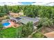 Overhead shot of a home's backyard showing the in-ground pool, green lawn, and mature landscaping at 12176 W Ohio Pl, Lakewood, CO 80228