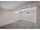 Finished basement featuring carpet, neutral colored walls, and two windows for natural light at 12176 W Ohio Pl, Lakewood, CO 80228