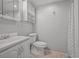 Bright bathroom featuring white fixtures, a neutral wall color, and a shower with modern shower curtain at 12176 W Ohio Pl, Lakewood, CO 80228