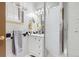Bathroom with updated vanity and decorative fixtures, and a glass enclosed shower with modern showerhead at 12176 W Ohio Pl, Lakewood, CO 80228