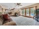 Spacious living room with sliding glass doors opening to a pool area, offering indoor-outdoor living at 12176 W Ohio Pl, Lakewood, CO 80228