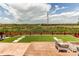 Backyard view featuring turf, patio, fence and open space at 14763 Pepper Pike Pl, Parker, CO 80134