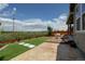 Backyard featuring artificial turf, a patio area, and community views at 14763 Pepper Pike Pl, Parker, CO 80134