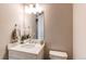 Well-lit bathroom featuring a white vanity, ample counter space, and modern fixtures at 14763 Pepper Pike Pl, Parker, CO 80134