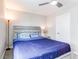 Simple yet cozy bedroom featuring a full bed, a ceiling fan, and light color walls at 14763 Pepper Pike Pl, Parker, CO 80134