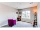 Aesthetic bedroom with decor including a guitar and side table, and a large window at 14763 Pepper Pike Pl, Parker, CO 80134