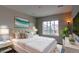 Stylish bedroom showcasing a large window and modern furnishings at 14763 Pepper Pike Pl, Parker, CO 80134