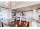 Dining area and kitchen show an open-concept layout perfect for modern living and entertaining at 14763 Pepper Pike Pl, Parker, CO 80134