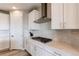 Modern kitchen design boasting quartz countertops, mosaic backsplash, and stainless steel range hood at 14763 Pepper Pike Pl, Parker, CO 80134