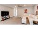 Bright living room with a large sectional sofa, contemporary decor, and neutral color palette at 14763 Pepper Pike Pl, Parker, CO 80134