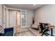 A clean office with a bright window view, complemented by a desk and modern decor at 14763 Pepper Pike Pl, Parker, CO 80134