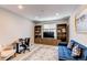 A functional office with desk, shelving, and a comfortable seating area, perfect for work or relaxation at 14763 Pepper Pike Pl, Parker, CO 80134