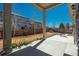 Covered patio looking out to a fenced yard that offers privacy and shade for outdoor enjoyment at 6434 N Ensenada Ct, Aurora, CO 80019
