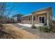 Backyard with stone accents, patio, and lawn perfect for outdoor living and entertaining guests at 6434 N Ensenada Ct, Aurora, CO 80019