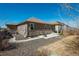 Expansive backyard featuring a patio area, lawn, and stone accents, ideal for outdoor enjoyment at 6434 N Ensenada Ct, Aurora, CO 80019