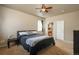 Carpeted bedroom with natural light and an ensuite bathroom for added convenience and privacy at 6434 N Ensenada Ct, Aurora, CO 80019