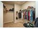 Walk-in closet with ample storage space for organizing clothes, shoes, and personal belongings at 6434 N Ensenada Ct, Aurora, CO 80019