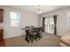 Bright dining area with sliding glass door and stylish modern table with chairs at 6434 N Ensenada Ct, Aurora, CO 80019