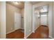 Inviting foyer with hardwood floors, multiple doorways, and natural light at 6434 N Ensenada Ct, Aurora, CO 80019