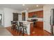 Kitchen featuring stainless steel appliances, hardwood floors, island, and wood cabinets at 6434 N Ensenada Ct, Aurora, CO 80019