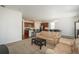 Open concept living room with a view of kitchen and dining area, perfect for entertaining at 6434 N Ensenada Ct, Aurora, CO 80019