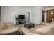 Open-concept living room with cozy seating and modern entertainment setup at 6434 N Ensenada Ct, Aurora, CO 80019