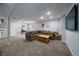 Finished basement living room area featuring recessed lighting, and a sectional sofa set at 14335 W Wesley Cir, Lakewood, CO 80228