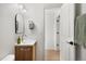 Modern bathroom features a stylish vanity, contemporary mirror, and sleek fixtures at 3070 N Glencoe St, Denver, CO 80207