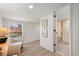 Bright bedroom features wood floors, neutral walls, natural light, and ensuite bath at 3070 N Glencoe St, Denver, CO 80207