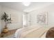 Cozy bedroom with neutral tones, light hardwood flooring, and a serene atmosphere at 3070 N Glencoe St, Denver, CO 80207