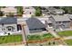 Aerial view of backyard, with lawn, wooden fence, patio, and low maintenance landscaping at 4642 Longs Peak St, Brighton, CO 80601