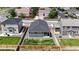 Aerial view of backyard, with lawn, wooden fence, patio, and low maintenance landscaping at 4642 Longs Peak St, Brighton, CO 80601