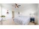 Spacious bedroom with a comfortable bed, a ceiling fan, and access to the bathroom and closet at 4642 Longs Peak St, Brighton, CO 80601