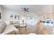 Bright living room with a comfortable sectional sofa, stylish decor, and seamless flow into the open-concept kitchen at 4642 Longs Peak St, Brighton, CO 80601
