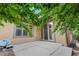Backyard patio with sliding glass doors and lush landscaping offering privacy at 1076 Rosemary St, Denver, CO 80230