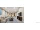 Spacious basement living area with plush seating, and a large screen tv for entertainment at 1076 Rosemary St, Denver, CO 80230
