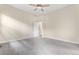 Bedroom with a neutral color palette, carpeted flooring, ceiling fan, and bathroom access at 1076 Rosemary St, Denver, CO 80230