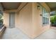 Charming building with a gray door, stucco walls, updated lighting, and a window at 1076 Rosemary St, Denver, CO 80230