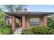 Inviting front exterior featuring a covered porch and manicured landscaping around the home at 1076 Rosemary St, Denver, CO 80230
