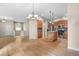 Bright kitchen with hardwood floors, stainless steel appliances, granite countertops, and kitchen island at 1076 Rosemary St, Denver, CO 80230
